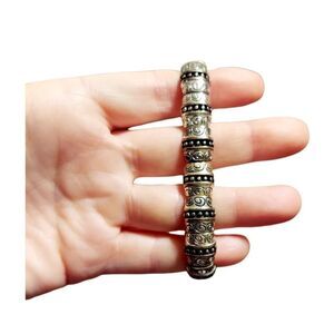 Silver and black stretch bracelet with swirl pattern